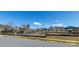 A delightful community playground with swings, slides, and climbing structures surrounded by a black fence at 246 Sweet Briar Dr, Fort Mill, SC 29707