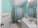 Cozy bathroom featuring a blue shower curtain, white tile walls, and vanity with sink at 2922 Dunlavin Way, Charlotte, NC 28205