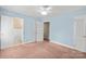 Spacious bedroom with light blue walls, two windows, and neutral carpet at 2922 Dunlavin Way, Charlotte, NC 28205
