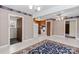 Open-concept dining and kitchen area featuring light-colored flooring and vintage wallpaper at 2922 Dunlavin Way, Charlotte, NC 28205