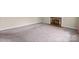 Cozy living room featuring a fireplace, large window, and neutral carpet at 2922 Dunlavin Way, Charlotte, NC 28205