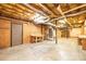 Unfinished basement showcasing potential with exposed ceiling, workbench, and utility features at 3863 Shakespeare Dr, Hickory, NC 28601