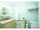 Clean bathroom featuring a granite countertop vanity, a toilet, and decorative elements with mint colored walls at 3863 Shakespeare Dr, Hickory, NC 28601