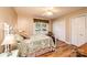 Bedroom featuring hardwood floors, a window for natural light, and a closet, offering a comfortable sleeping space at 3863 Shakespeare Dr, Hickory, NC 28601