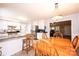 Open concept dining area adjacent to the kitchen, featuring natural light and a breakfast bar at 3863 Shakespeare Dr, Hickory, NC 28601