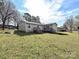 Lush backyard with multiple decks and ample space for recreation at 464 Willetta Nw Pl, Concord, NC 28027