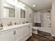 Bathroom featuring a double sink vanity, wood-look floors, and a shower/tub combination at 464 Willetta Nw Pl, Concord, NC 28027