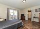 Comfortable bedroom with a sliding glass door leading to a private deck area at 464 Willetta Nw Pl, Concord, NC 28027