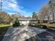 Charming single-story home with a spacious driveway and well-maintained lawn at 464 Willetta Nw Pl, Concord, NC 28027