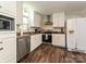 Charming kitchen with stainless steel appliances, light countertops, and sleek wood-style floors at 464 Willetta Nw Pl, Concord, NC 28027