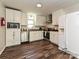 Updated kitchen featuring white cabinetry, stainless steel appliances, and ample counter space at 464 Willetta Nw Pl, Concord, NC 28027
