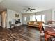 Living room featuring hardwood floors, neutral decor, and a comfortable seating arrangement at 464 Willetta Nw Pl, Concord, NC 28027