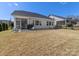 Relaxing backyard with covered patio, outdoor seating, and grilling area at 5013 Watercrest Trl, Belmont, NC 28012
