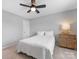 Simple bedroom with neutral walls, plush carpet, a ceiling fan, a full sized bed, and a night stand at 5013 Watercrest Trl, Belmont, NC 28012