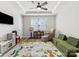 Bright playroom with an educational rug, comfortable green couch, neutral walls, and plenty of room to play at 5013 Watercrest Trl, Belmont, NC 28012