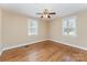 Relaxing bedroom with hardwood floors, two windows, and neutral wall colors at 502 Crawford St, Shelby, NC 28150