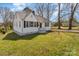 Quaint one-story home featuring white siding, black shutters, and a spacious front yard at 502 Crawford St, Shelby, NC 28150