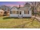 Charming one-story home with white siding, black shutters, and a well-maintained lawn at 502 Crawford St, Shelby, NC 28150