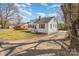 Inviting one-story home with white siding, black shutters, and a long driveway at 502 Crawford St, Shelby, NC 28150