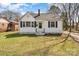 Charming one-story home with white siding, black shutters, and a well-maintained lawn at 502 Crawford St, Shelby, NC 28150