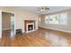 Spacious living room with hardwood floors, a fireplace, and plenty of natural light at 502 Crawford St, Shelby, NC 28150