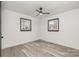 Bedroom featuring hardwood floors, white walls, and two windows for ample light at 5674 Alan D Good Ln, Conover, NC 28613