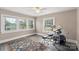 This bedroom features hardwood floors, natural light and neutral paint at 609 Eddleman Rd, Kannapolis, NC 28083