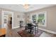 This bedroom features hardwood floors, natural light and neutral paint at 609 Eddleman Rd, Kannapolis, NC 28083