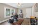 This bedroom features hardwood floors, natural light and neutral paint at 609 Eddleman Rd, Kannapolis, NC 28083