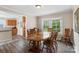 Cozy dining area featuring natural light and wood accents at 609 Eddleman Rd, Kannapolis, NC 28083