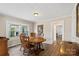 Traditional dining room with wood table and chairs with plenty of natural light at 609 Eddleman Rd, Kannapolis, NC 28083