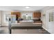 Cozy kitchen with stainless steel refrigerator, light wood cabinets, and windows offering natural light at 609 Eddleman Rd, Kannapolis, NC 28083