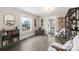 The living room features hardwood floors, natural light, and a view of the dining area at 609 Eddleman Rd, Kannapolis, NC 28083
