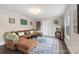 A modern living room features a cozy couch and stylish decor at 609 Eddleman Rd, Kannapolis, NC 28083