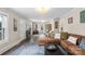 A living room features a large, comfortable sectional couch with a ottoman at 609 Eddleman Rd, Kannapolis, NC 28083