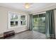 Bright living room featuring hardwood floors, beadboard walls, and sliding glass doors to the outside at 609 Eddleman Rd, Kannapolis, NC 28083