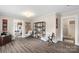A living room is shown with two chairs facing a doorway to the kitchen at 609 Eddleman Rd, Kannapolis, NC 28083