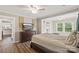 Comfortable primary bedroom featuring hardwood floors and neutral decor at 609 Eddleman Rd, Kannapolis, NC 28083
