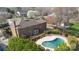 Aerial view of a beautiful home featuring a deck and a kidney shaped swimming pool at 725 Stanhope Ln, Matthews, NC 28105