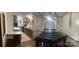 Dining area showcasing table and chairs near well-equipped kitchen at 8183 Hallman Mill Rd, Vale, NC 28168