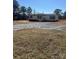 Charming single story home with gravel driveway and inviting front porch and dark shutters at 8183 Hallman Mill Rd, Vale, NC 28168