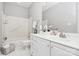 Bright bathroom featuring white cabinets, white countertops, and tile floors at 8462 Highland Glen Dr, Charlotte, NC 28269