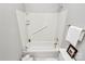 Bathroom featuring a shower-tub combo with white tile surround at 8462 Highland Glen Dr, Charlotte, NC 28269