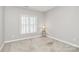 Bright bedroom featuring plantation shutters, neutral walls, and trim at 8462 Highland Glen Dr, Charlotte, NC 28269