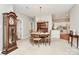 Open dining area flows seamlessly into the kitchen, featuring an antique clock for a touch of classic charm at 8462 Highland Glen Dr, Charlotte, NC 28269