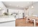 Spacious kitchen featuring modern white appliances and an adjacent breakfast table at 8462 Highland Glen Dr, Charlotte, NC 28269