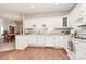 Open kitchen with modern white appliances and plenty of counter space for cooking at 8462 Highland Glen Dr, Charlotte, NC 28269