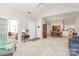 Open-concept living room with carpet, flowing into the dining area and kitchen for easy entertaining at 8462 Highland Glen Dr, Charlotte, NC 28269