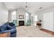 Bright living room boasts a fireplace, vaulted ceiling, and neutral paint, creating a comfortable space at 8462 Highland Glen Dr, Charlotte, NC 28269