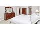 Large main bedroom featuring wood dressers and ensuite bathroom at 8462 Highland Glen Dr, Charlotte, NC 28269
